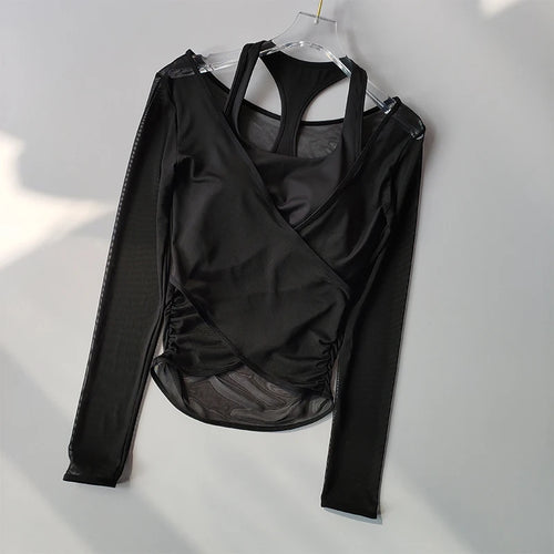 Black long-sleeve wrap top with sheer panels on a white background