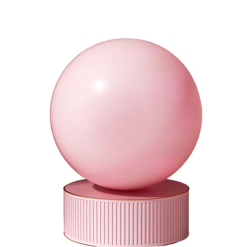 Pink pilates ball on a white background 