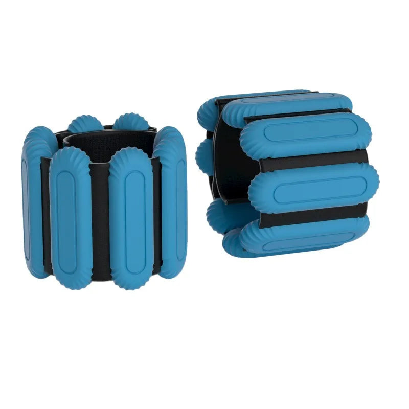 Blue and black ankle or wrist strap weights on a white background