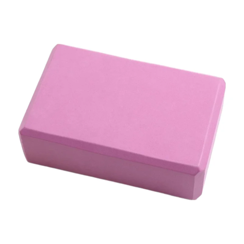Pink yoga block on a white background