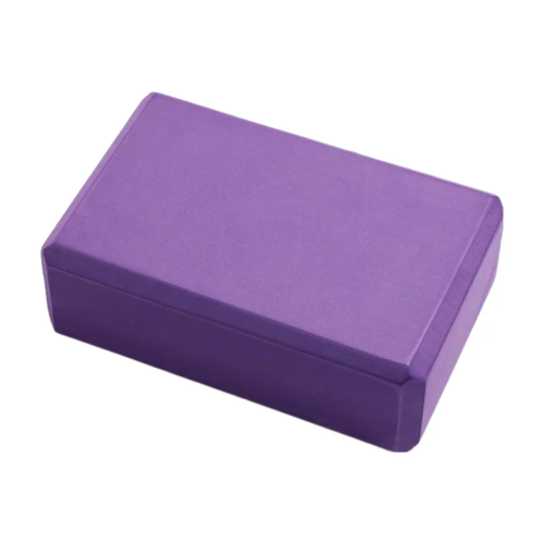 Purple yoga block on a white background