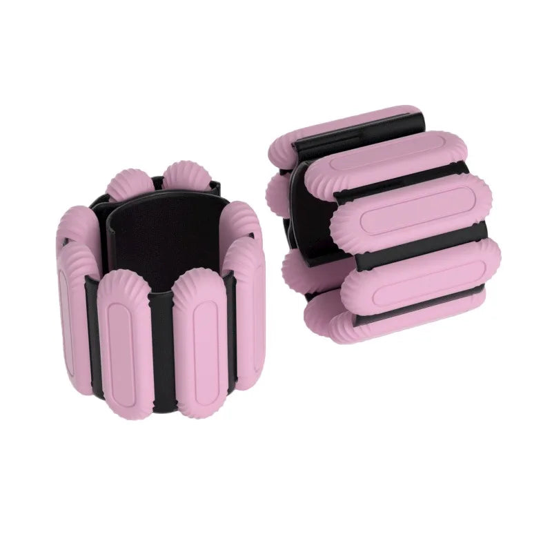 Pink and black adjustable weight plates on a white background
